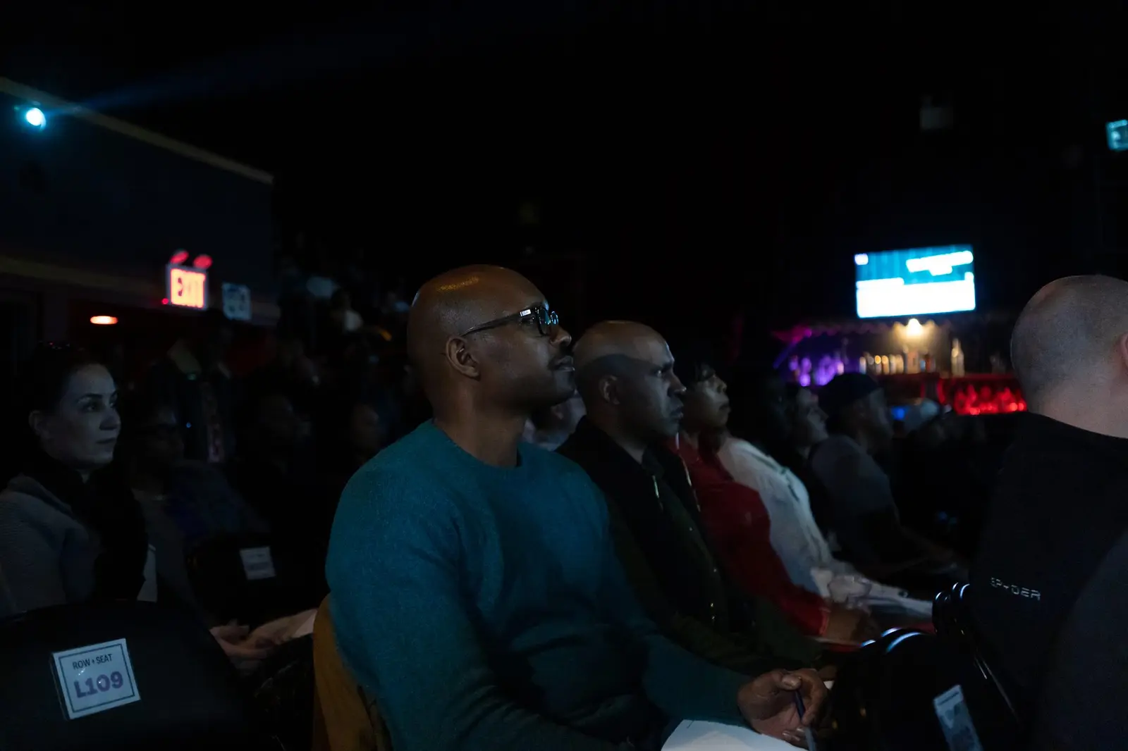 Audience members watching a session at a previous event