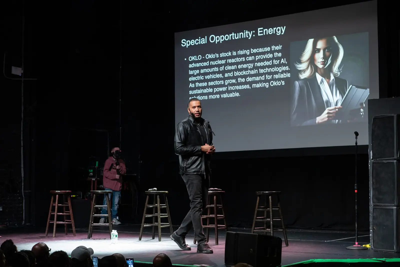 Armando Pantoja presenting an energy slide on stage at a previous event