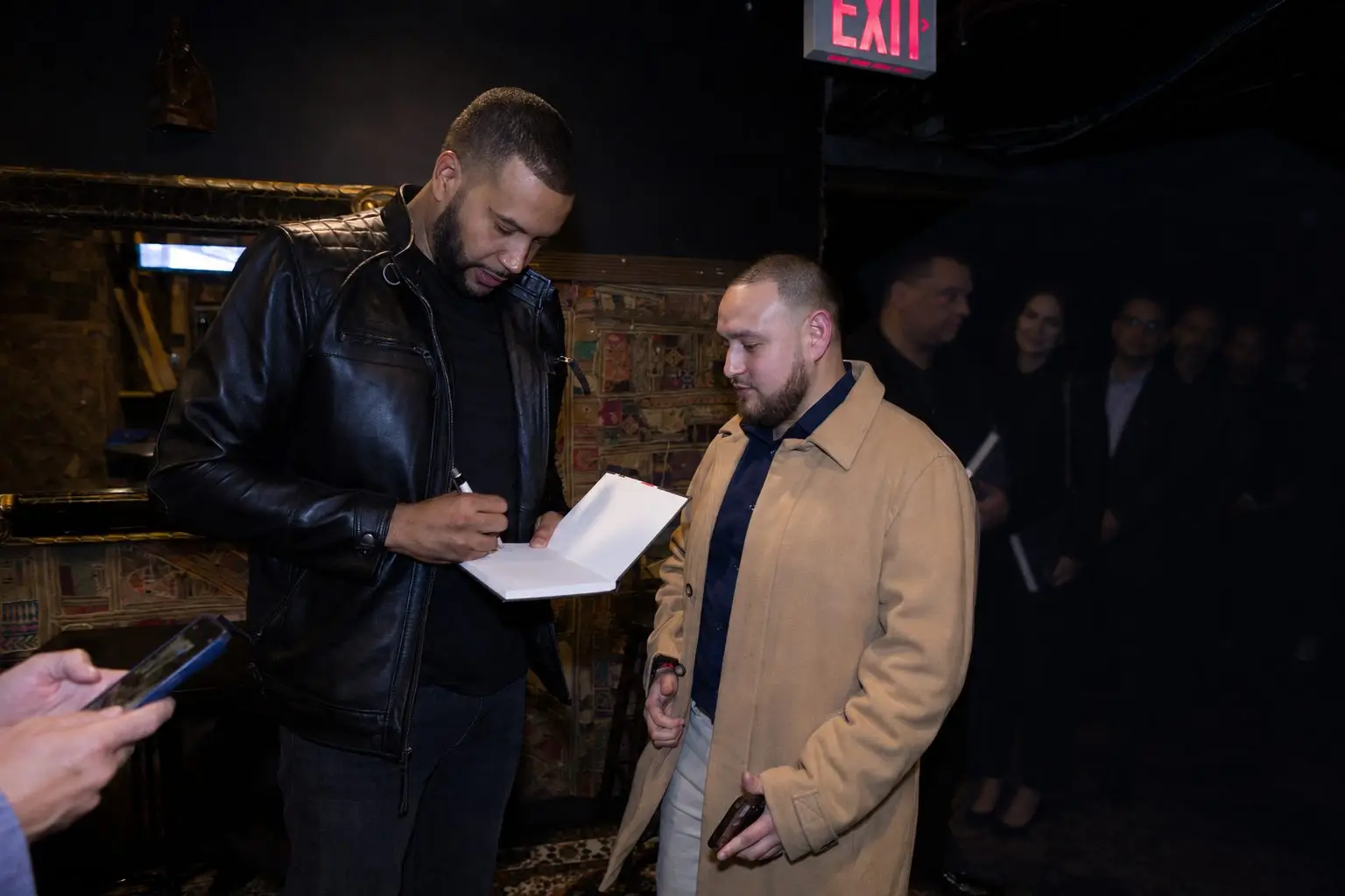 Armando Pantoja signing for an attendee at a previous event